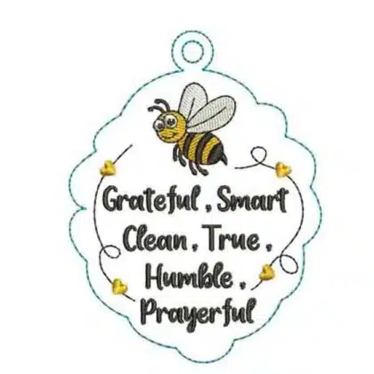 An inspirational machine embroidery ornament design featuring a cute bumblebee and the words "Grateful, Smart, Clean, True, Humble, Prayerful" inside a scalloped border.