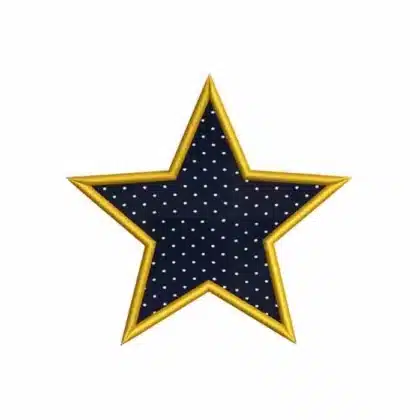 Classic star applique machine embroidery design with a thick gold satin stitch border, shown with navy blue polka-dot fabric.